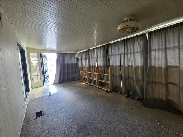 a kitchen with stainless steel appliances granite countertop a refrigerator and a stove