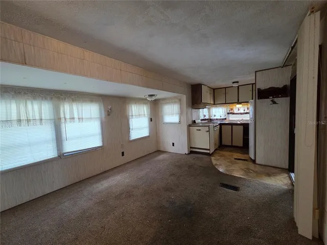a white toilet sitting next to a bathroom sink and a shower