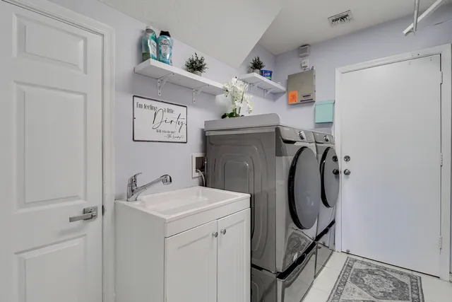 a utility room with dryer and washer
