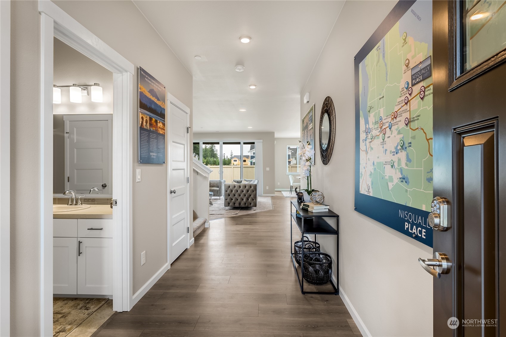 3040 Stephanie Loop Northeast Lacey, WA 98516 - Photo 8 of 14 a view of a hallway with wooden floor and living room
