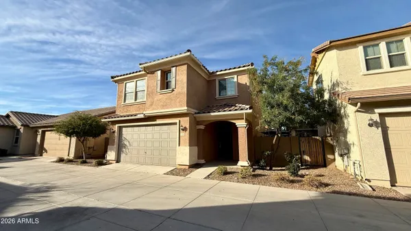 a front view of a house with parking