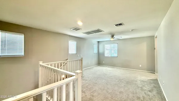 a view of an empty room with stairs