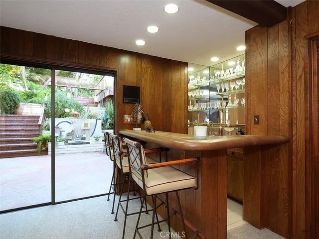 a kitchen with a table and chairs in it