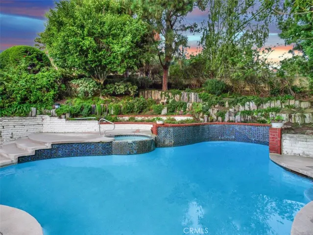 a view of a swimming pool with a patio