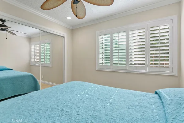 a bedroom with bed and a window