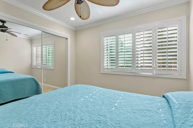 a bedroom with bed and a window