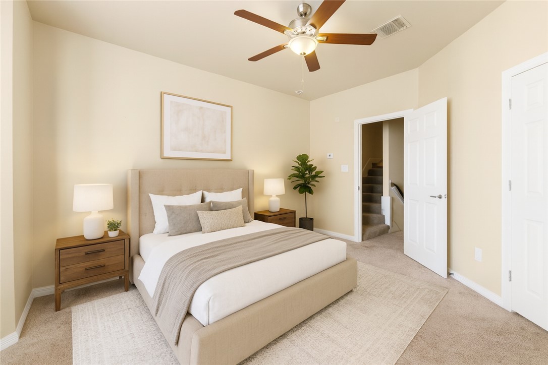 1198 Jones-Butler Road, Unit 705 College Station, TX 77840 - Photo 18 of 34 Bedroom featuring light colored carpet and a ceiling fan