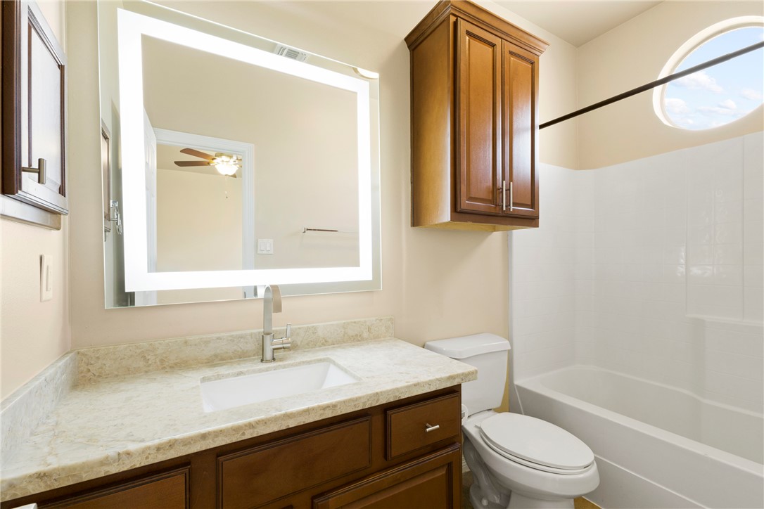 1198 Jones-Butler Road, Unit 705 College Station, TX 77840 - Photo 20 of 34 Bathroom featuring vanity, shower / washtub combination, and a ceiling fan