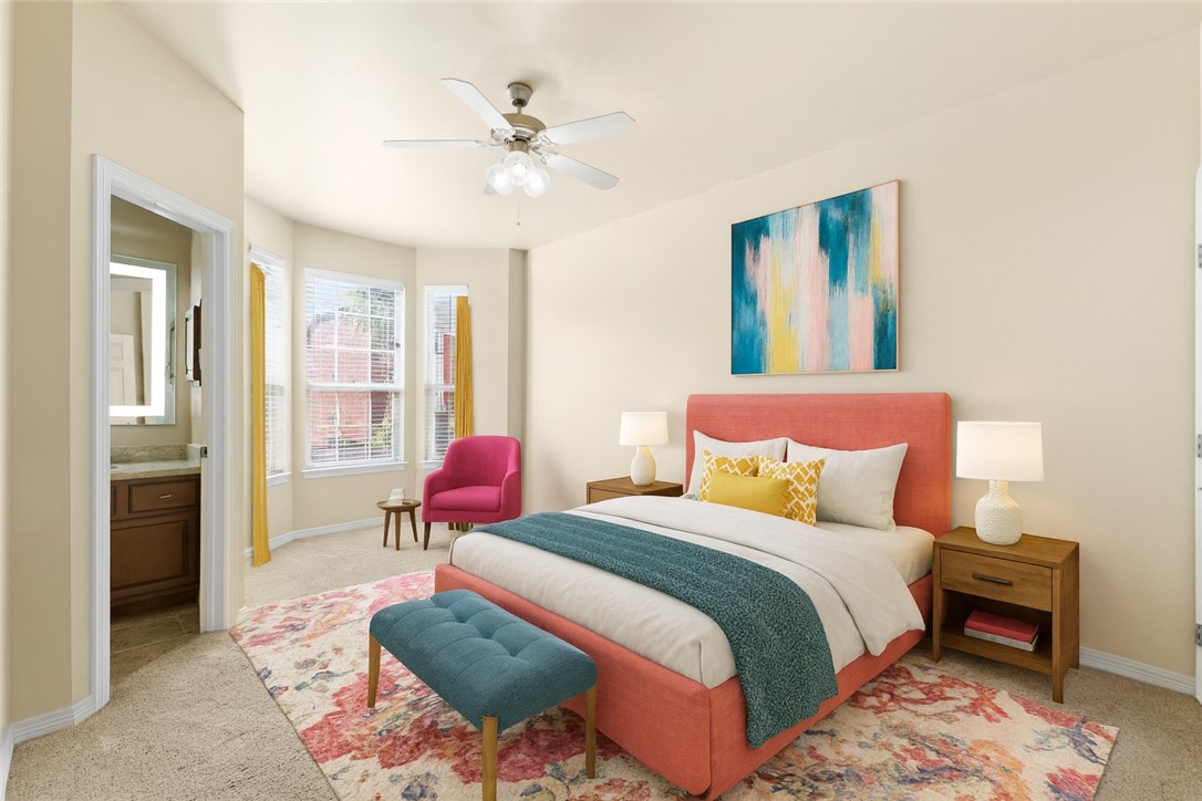 1198 Jones-Butler Road, Unit 705 College Station, TX 77840 - Photo 21 of 34 Bedroom with light carpet, ensuite bath, and ceiling fan