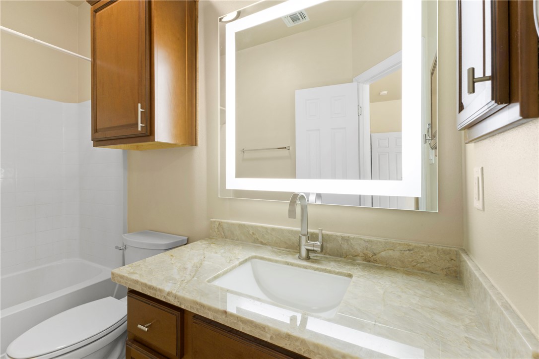 1198 Jones-Butler Road, Unit 705 College Station, TX 77840 - Photo 23 of 34 Full bathroom featuring vanity and washtub / shower combination