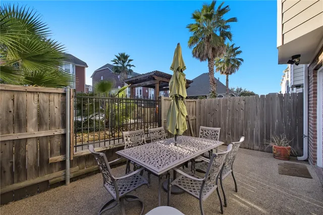 a view of a patio with a table and chairs