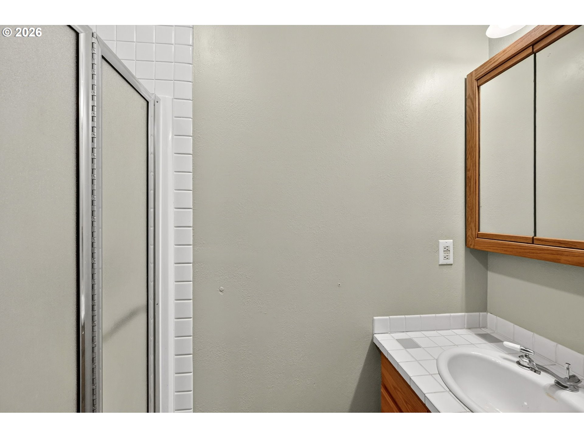 11811 Southwest 34th Avenue Portland, OR 97219 - Photo 15 of 39 a bathroom with a sink and mirror