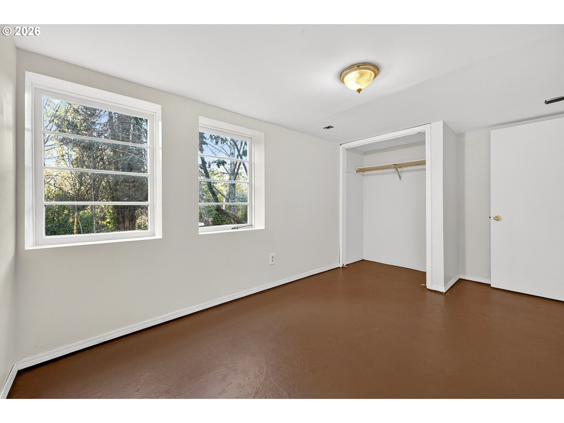11811 Southwest 34th Avenue Portland, OR 97219 - Photo 19 of 39 a view of an empty room with a window