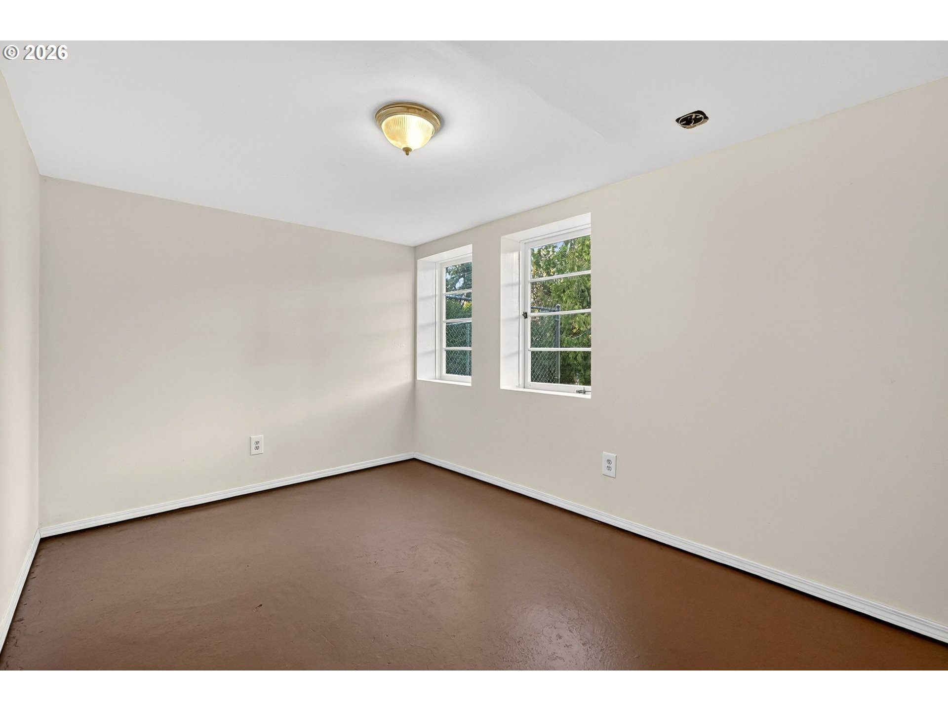 11811 Southwest 34th Avenue Portland, OR 97219 - Photo 20 of 39 a view of an empty room with a window