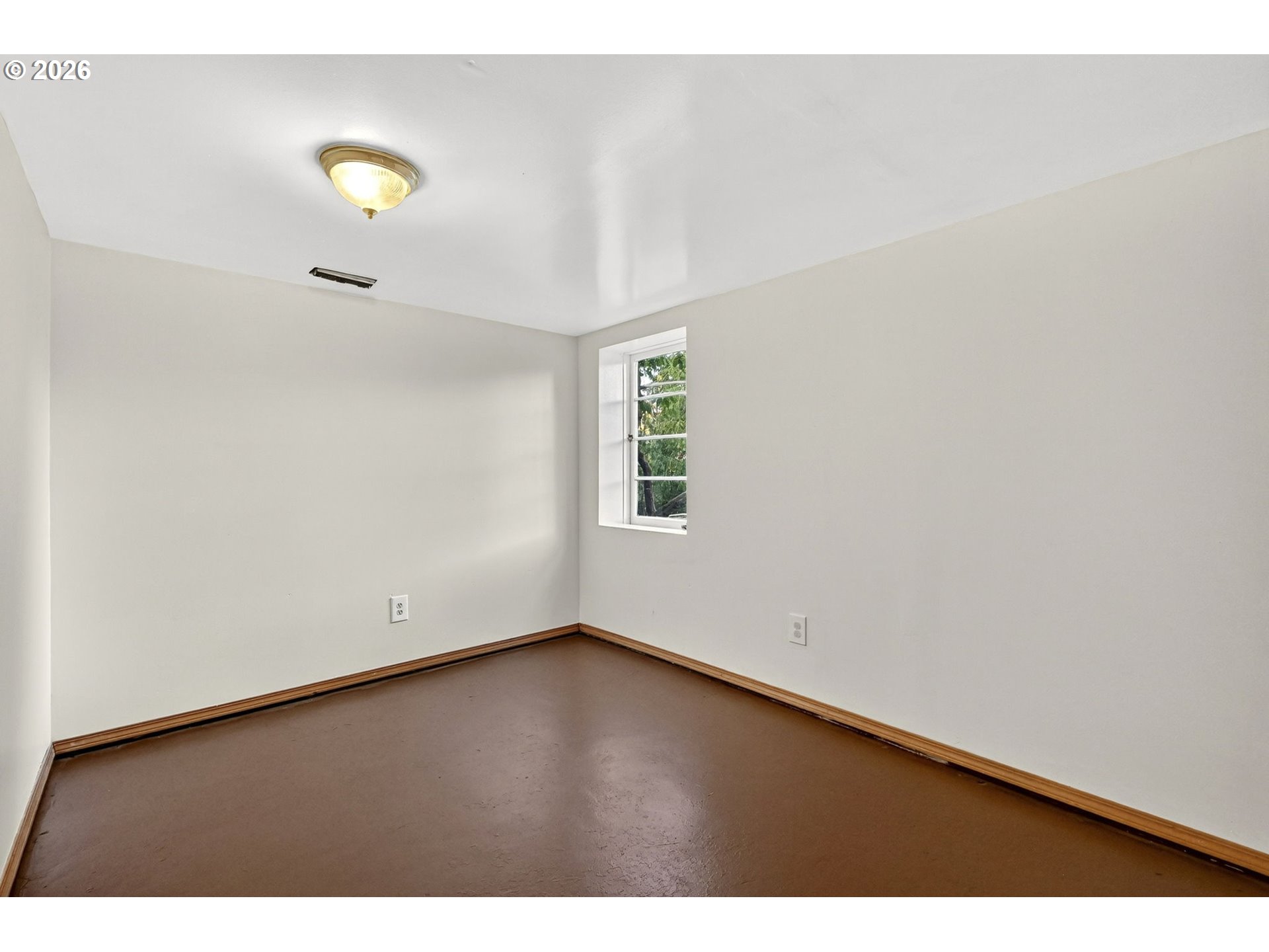 11811 Southwest 34th Avenue Portland, OR 97219 - Photo 21 of 39 a view of an empty room with a window