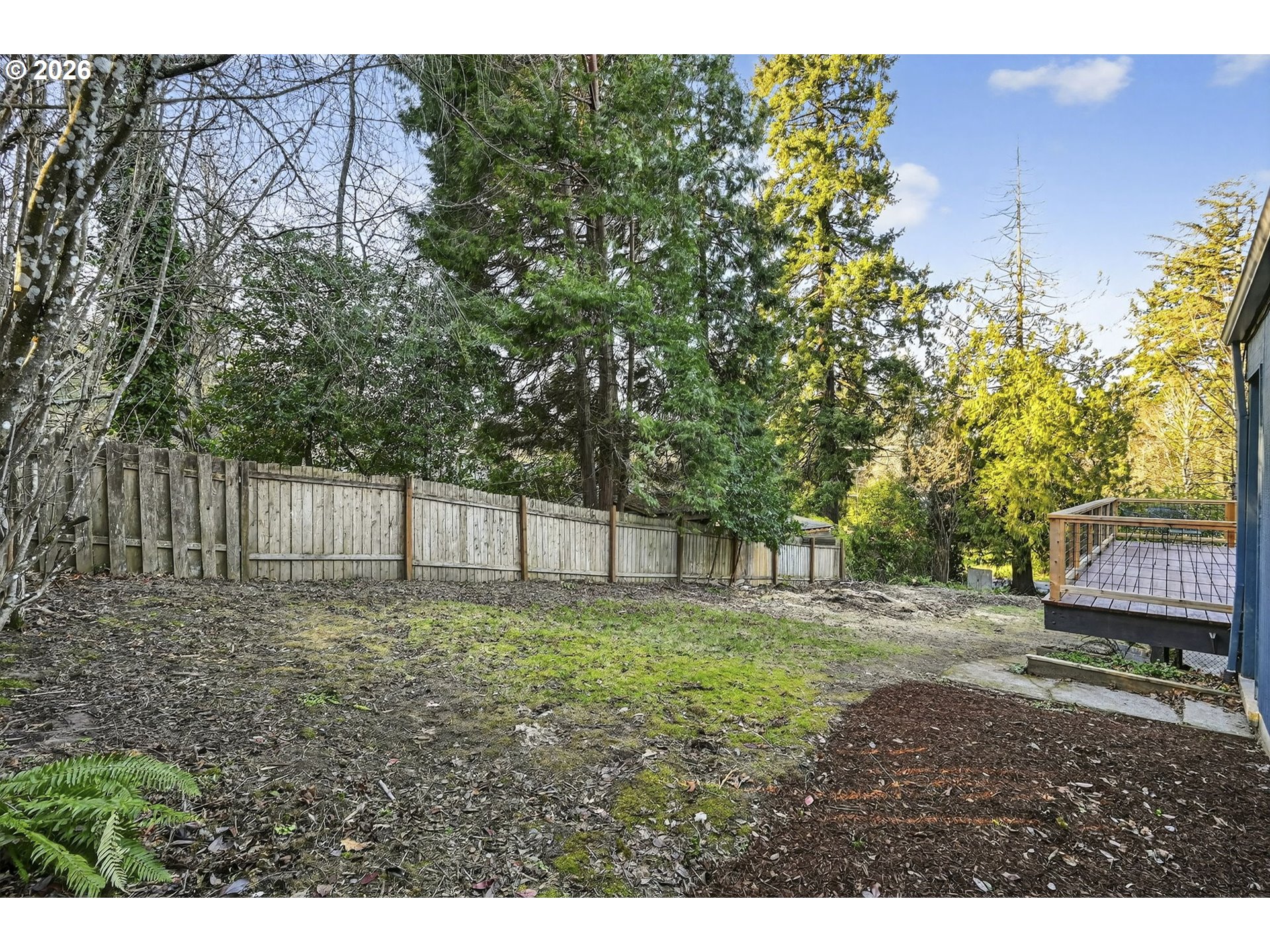 11811 Southwest 34th Avenue Portland, OR 97219 - Photo 33 of 39 a backyard of a house with lots of green space