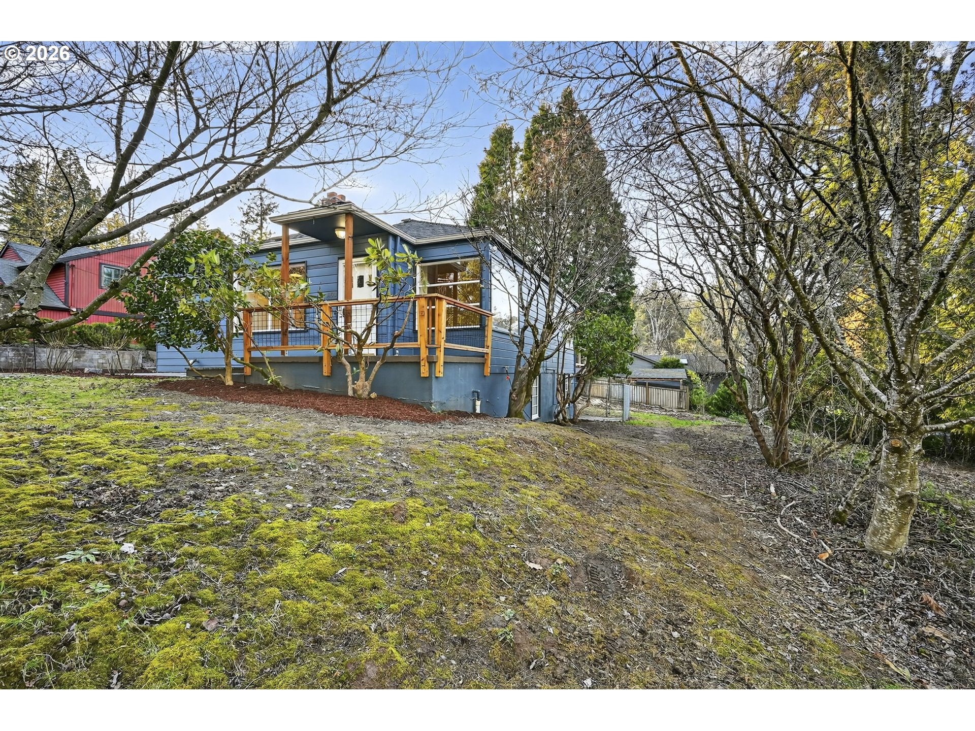 11811 Southwest 34th Avenue Portland, OR 97219 - Photo 37 of 39 a view of a house with a yard