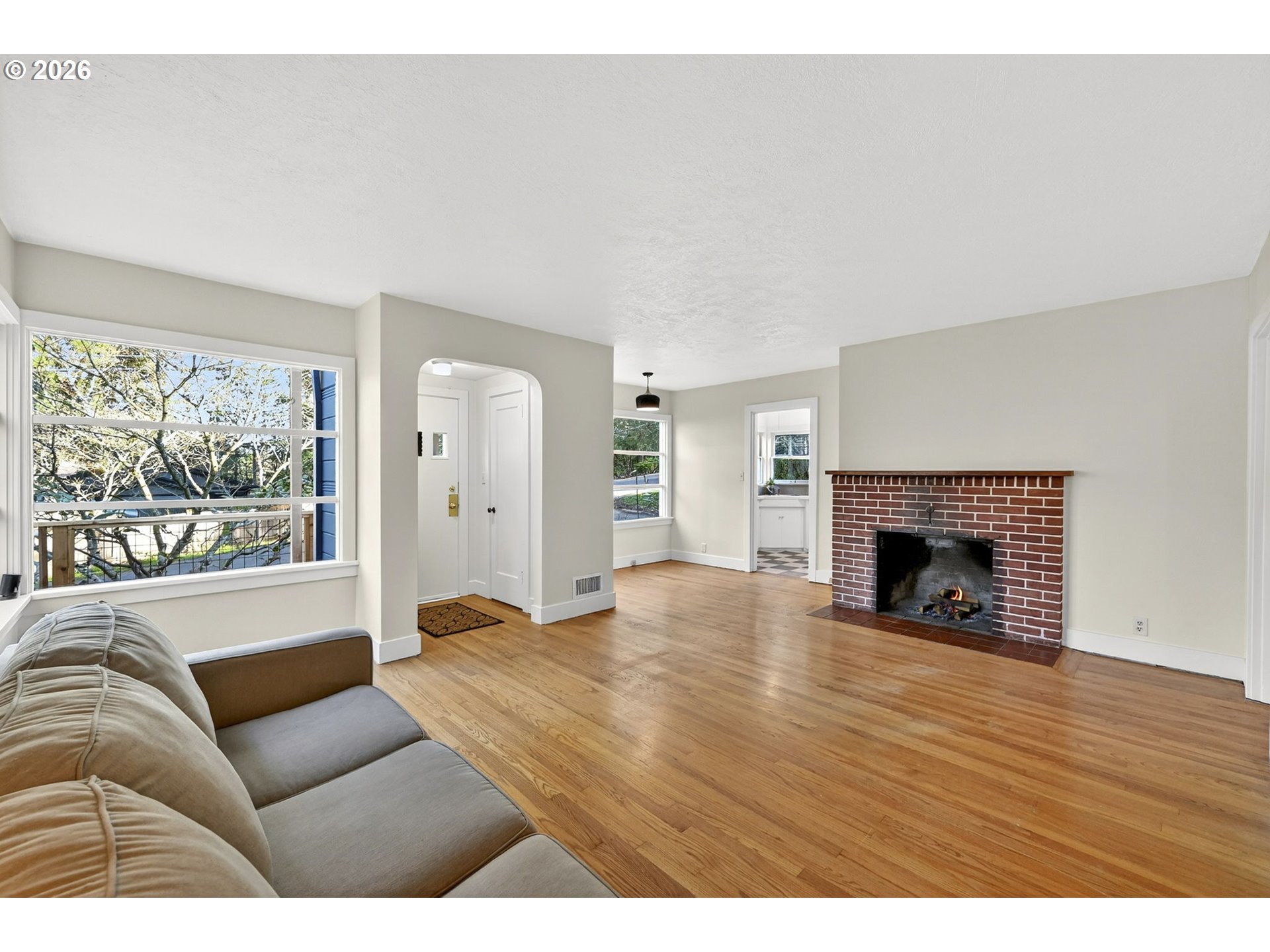 11811 Southwest 34th Avenue Portland, OR 97219 - Photo 6 of 39 a living room with furniture and a fireplace