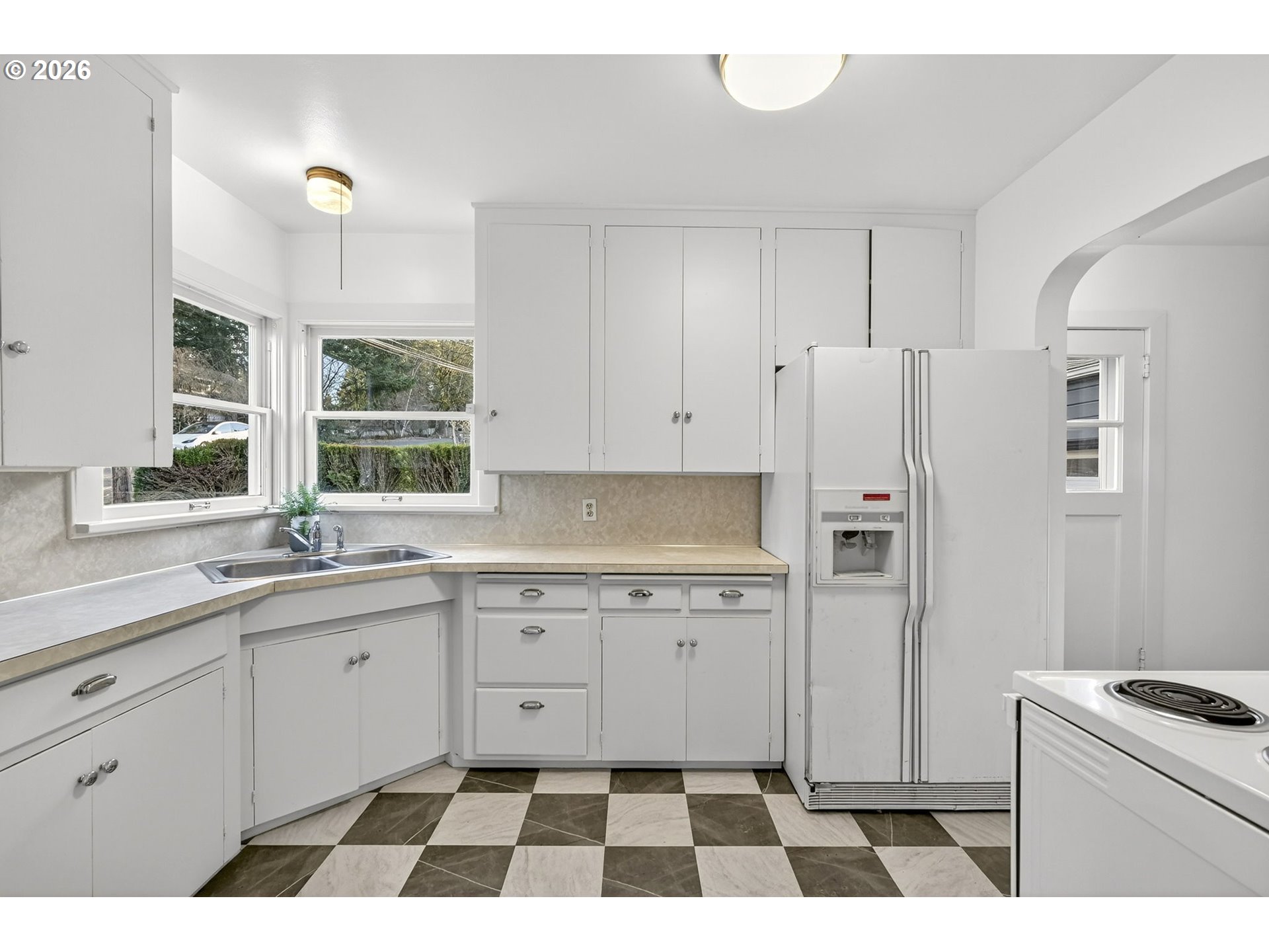 11811 Southwest 34th Avenue Portland, OR 97219 - Photo 9 of 39 a kitchen with a refrigerator and a sink