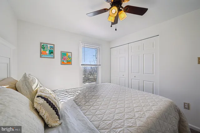 a bathroom with a sink mirror and toilet