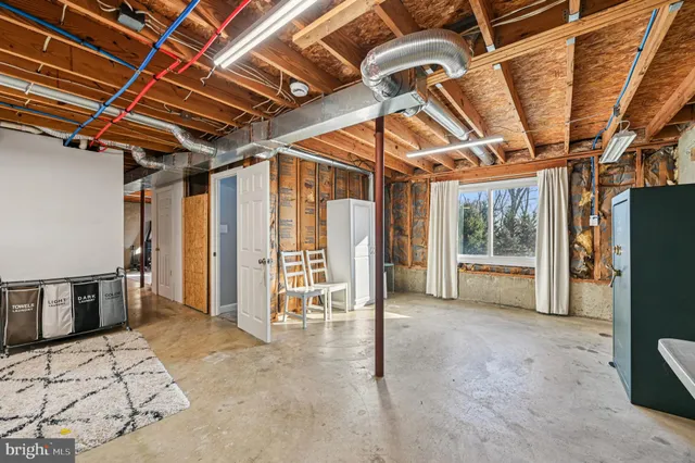 a view of a livingroom with furniture and a flat screen tv