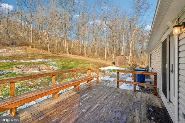a front view of a house with a yard table and chairs