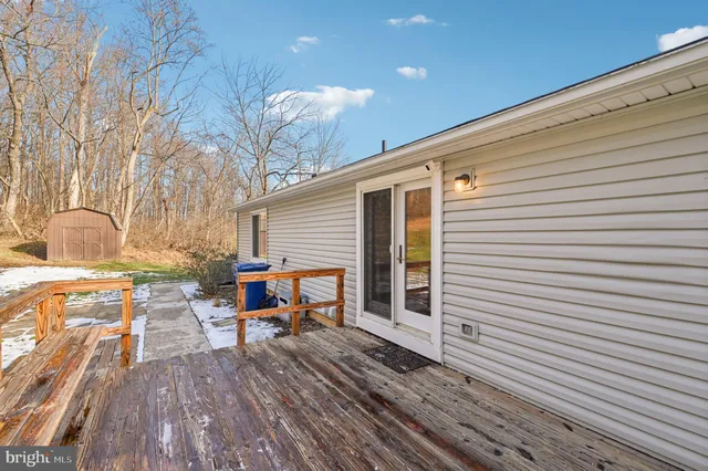 a front view of a house with a yard table and chairs
