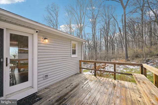 a front view of a house with a yard table and chairs