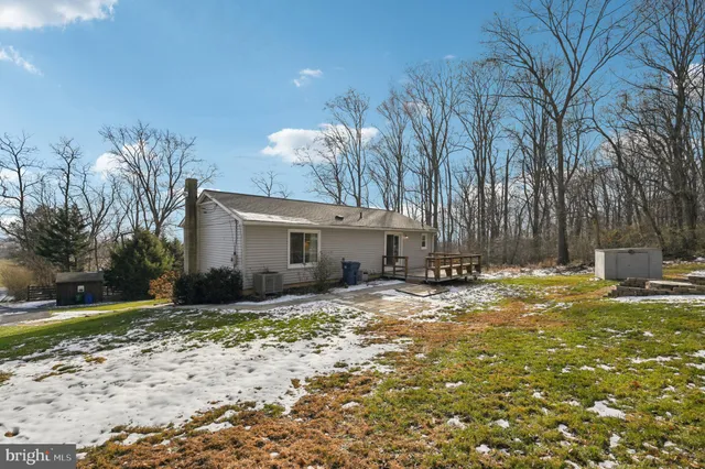 a aerial view of a house with a yard