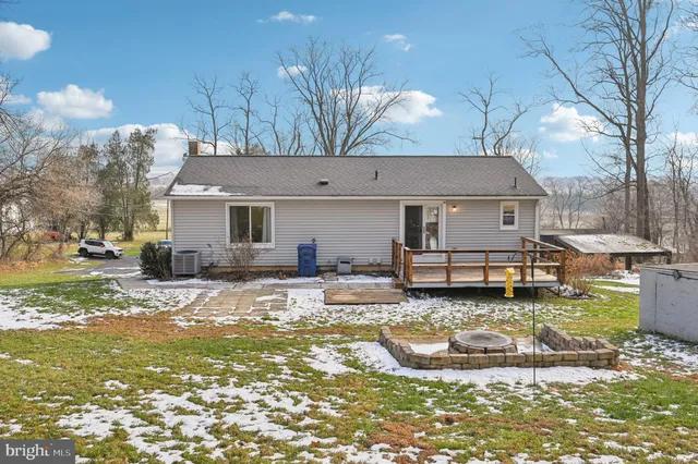 an aerial view of a house with garden space and street view