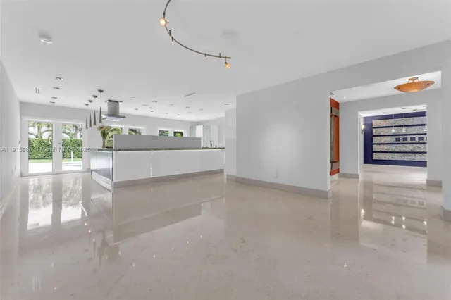 a bathroom with a granite countertop sink and a window