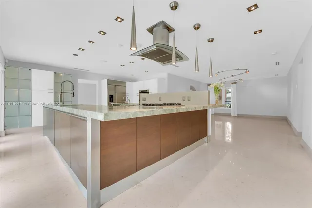 a view of an empty room with windows