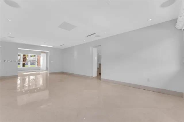 a bathroom with a granite countertop sink a toilet and a mirror