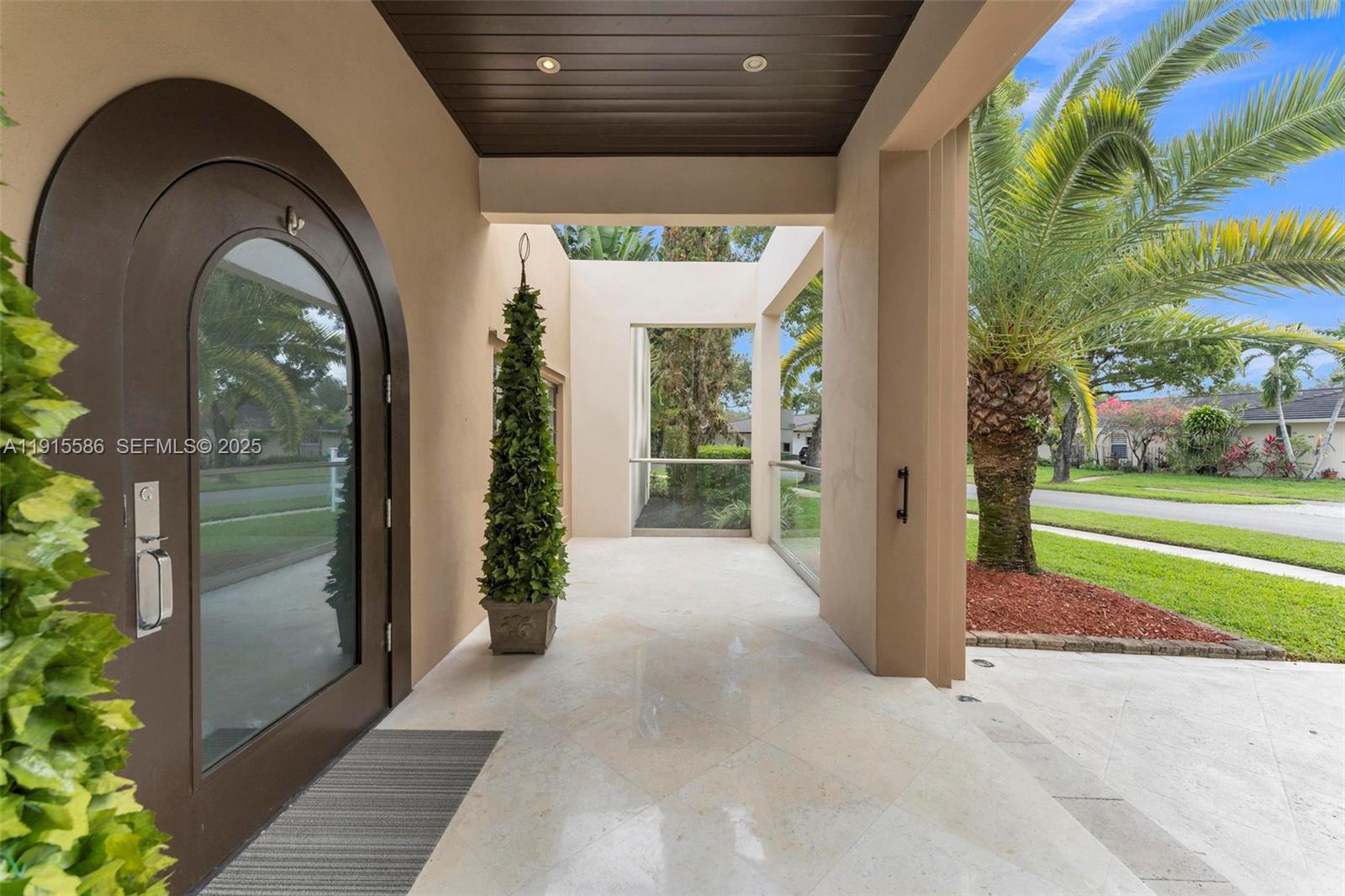 7261 West Troon Circle Miami Lakes, FL 33014 - Photo 5 of 61 a view of entrance gate of a house