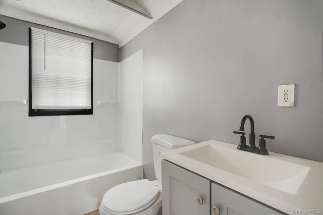 a bathroom with a sink toilet and bathtub