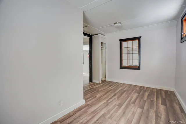 a view of empty room with windows