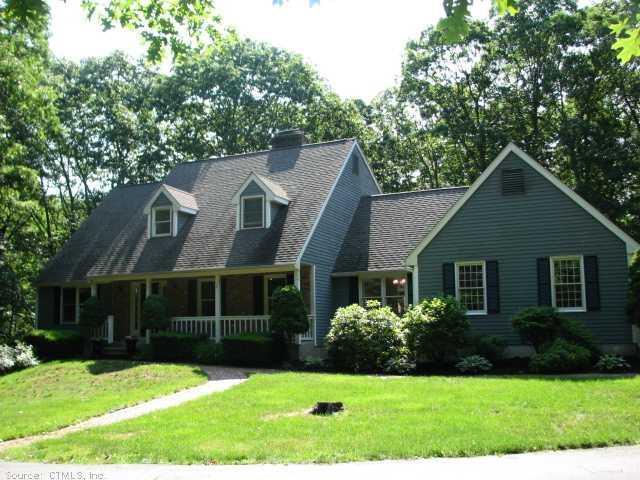 4 Sportsman Hill Road Madison, CT 06443 - Photo 1 of 1 a front view of a house with a yard