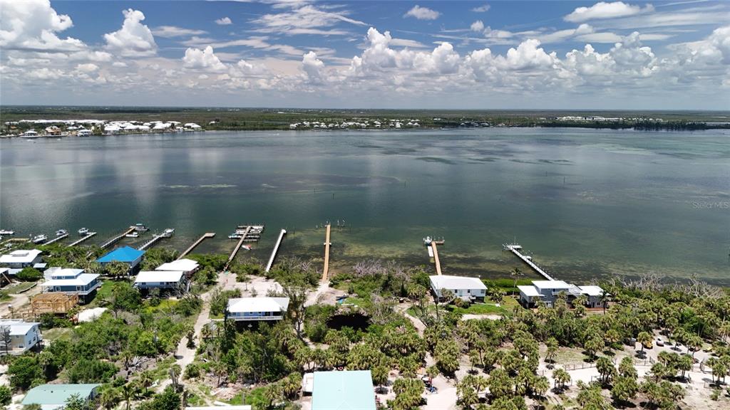 8964 Seagrape Lane Placida, FL 33946 - Photo 13 of 20 a view of a lake with a city