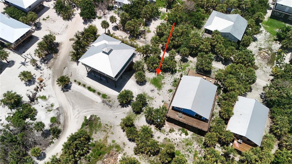 8964 Seagrape Lane Boca Grande, FL 33921 - Photo 14 of 20 an aerial view of a house with a yard and lake view