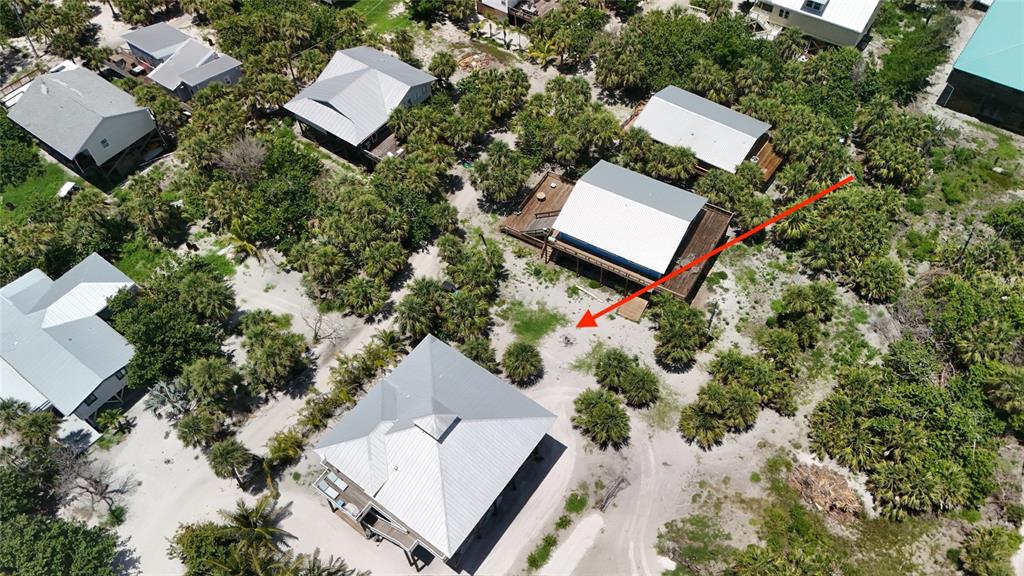 8964 Seagrape Lane Placida, FL 33946 - Photo 16 of 20 an aerial view of a house with a yard and lake view