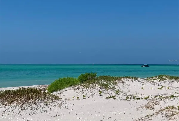 a view of a lake with a beach