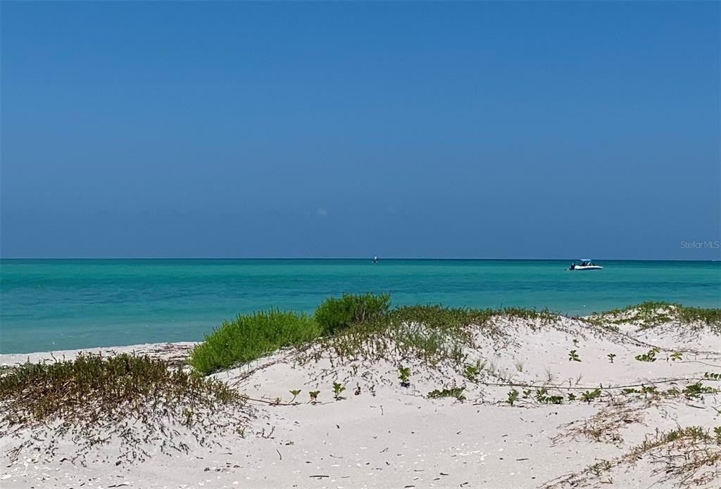 8964 Seagrape Lane Boca Grande, FL 33921 - Photo 17 of 20 a view of a lake with a beach