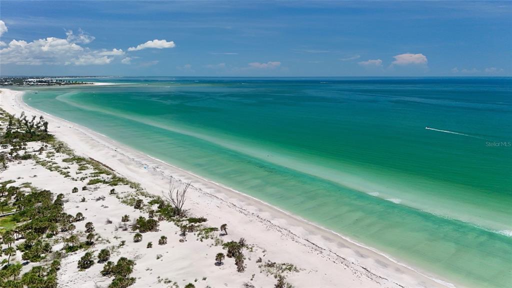 8964 Seagrape Lane Boca Grande, FL 33921 - Photo 18 of 20 a view of a golf course with a lake