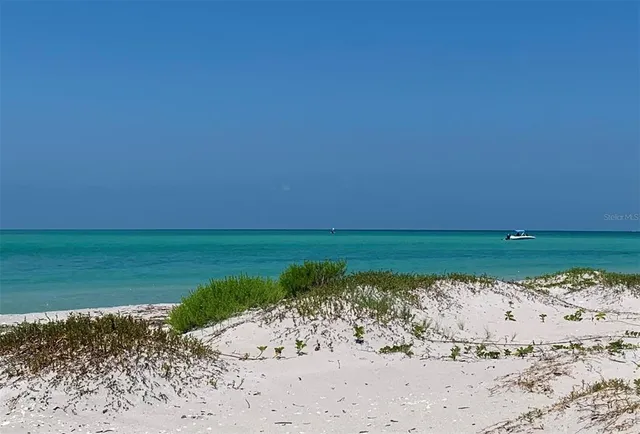 a view of a lake with a beach