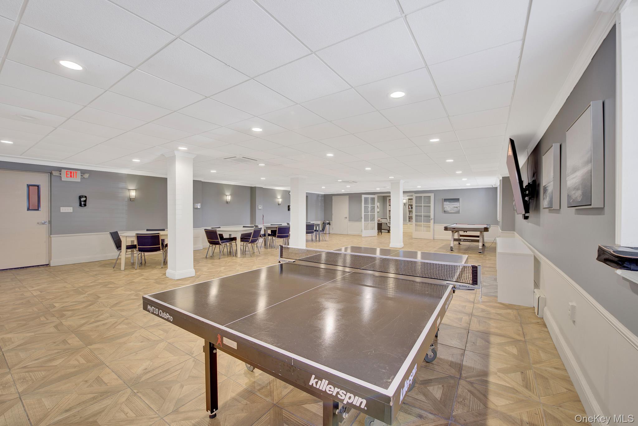700 Shore Road, Unit 5M Long Beach, NY 11561 - Photo 19 of 34 Recreation Room With Big Screen TV , Kitchen, Library, Ping Pong Table And Air Hockey...