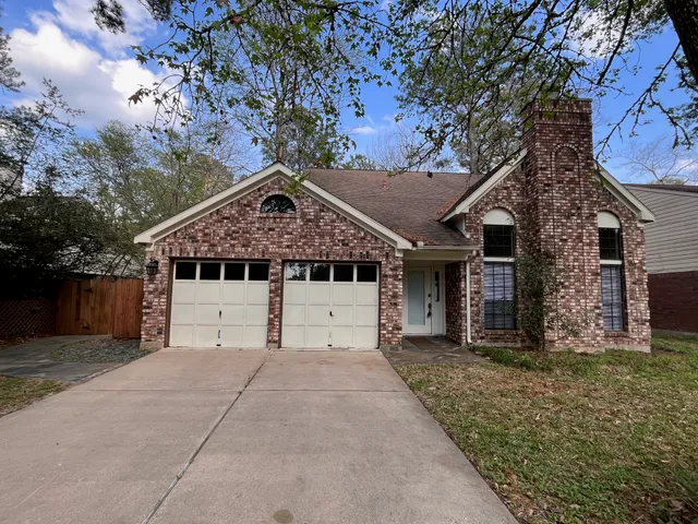 a house that has a tree in front of the house