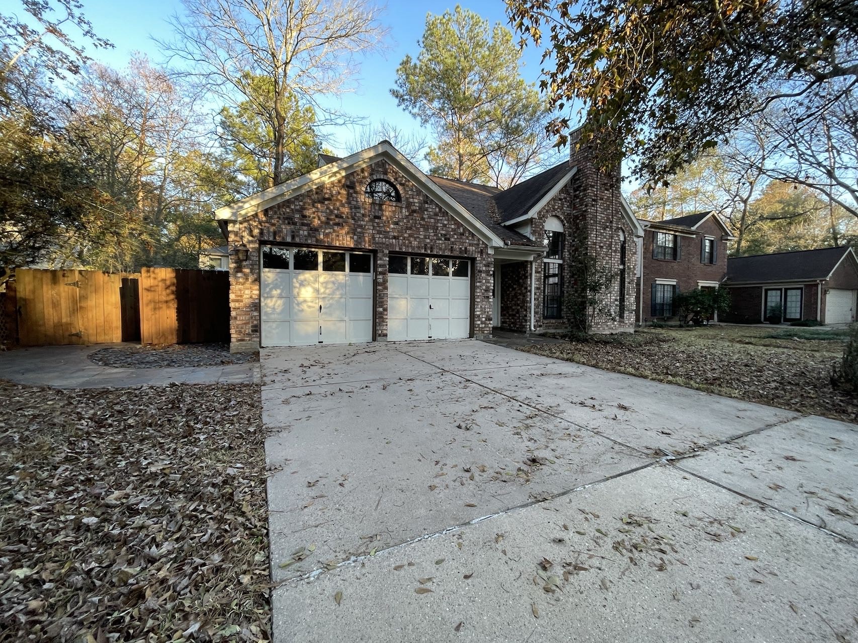 88 West Rainbow Ridge Circle The Woodlands, TX 77381 - Photo 3 of 16 a front view of a house with a yard