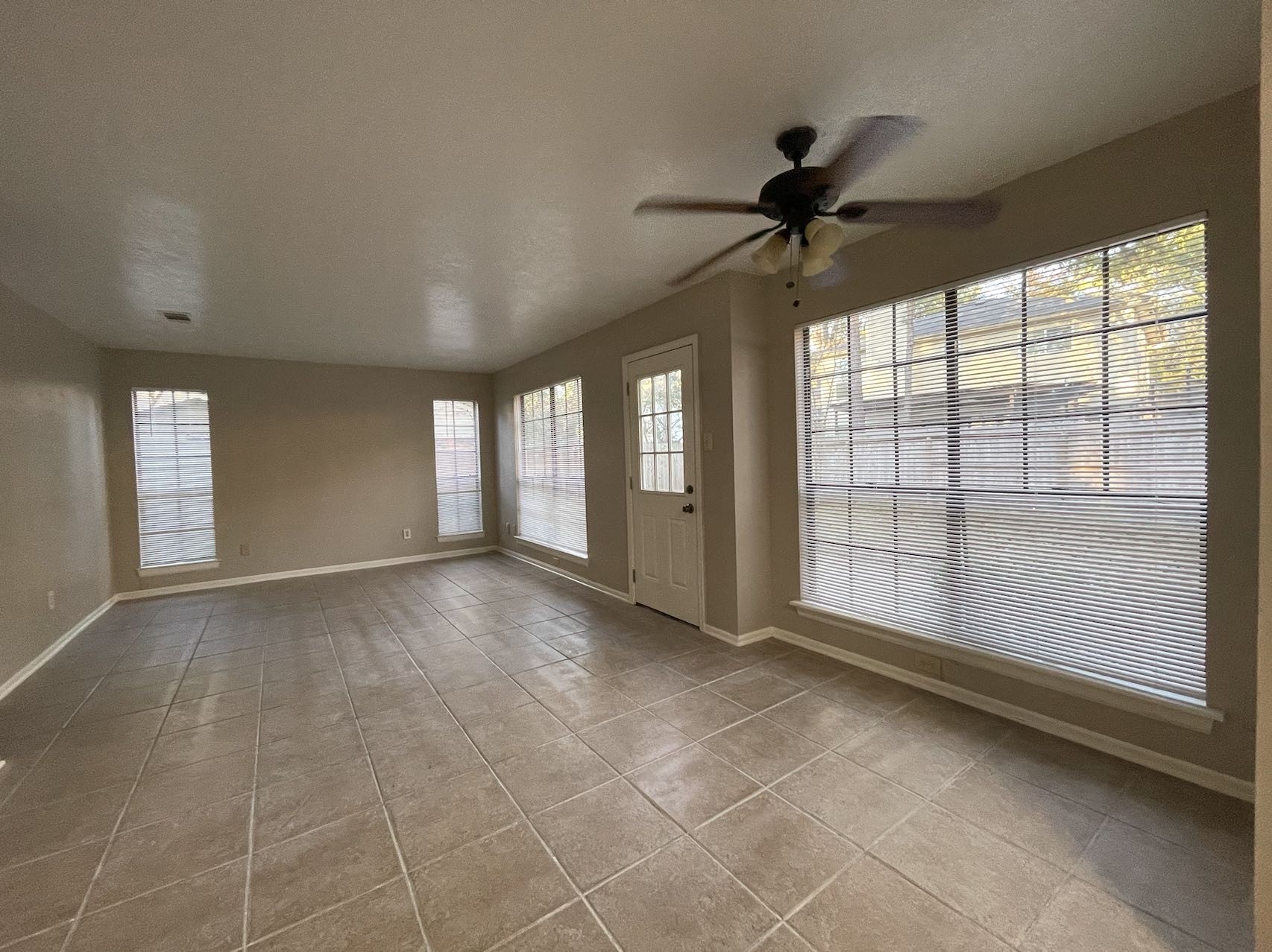 88 West Rainbow Ridge Circle The Woodlands, TX 77381 - Photo 10 of 16 a view of an empty room with a window