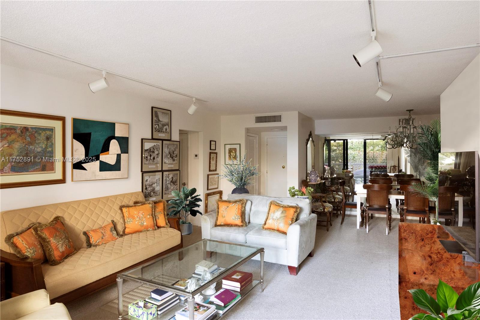 1121 Crandon Boulevard, Unit E203 Key Biscayne, FL 33149 - Photo 3 of 22 a living room with furniture and a large window