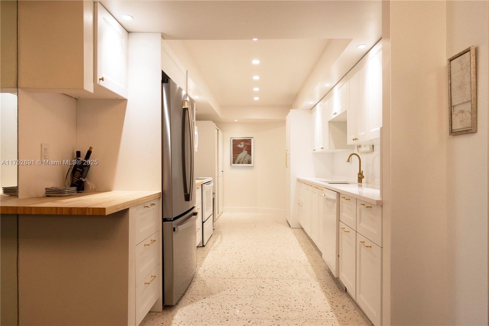 1121 Crandon Boulevard, Unit E203 Key Biscayne, FL 33149 - Photo 6 of 22 a bathroom with a sink a mirror and a shower